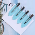 Set of four blue glitter resin duckbill hair clips on white card display - Crystal Blue