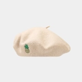 Close-up of wool beret with detailed pineapple embroidery and soft beige fabric texture - One Size / Beige