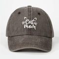 Close-up of embroidered Cat Mom lettering and kitten ears on washed grey baseball cap - Coffee