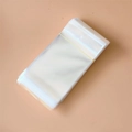 Close-up of clear self-sealing plastic jewelry bags stacked with a rubber band - 8*15cm-With Hanging Hole-Double Layer 90 Microns (100 Pieces/Pack)