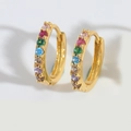 Close-up of golden hoop earrings with multi-colored rainbow cubic zirconia stones - Colorful