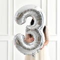 Large 40 inch silver number 3 foil balloon held by a model for birthday party decor - Silver Style 3