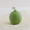 Green lime shaped scented candle with realistic texture, height 7cm and width 6.5cm - Vertical Lemon Green