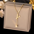 Detailed shot of golden Y letter necklace with minimalist cube pendant on a jewelry box - Letter Y-Gold