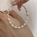 Macro detail of elegant pearl and silver irregular liquid metal bracelet on wrist - Liquid Feel Pearl Splicing (SL0942)