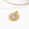 Macro shot of two-tone religious medal pendant featuring pink crystal beads and gold frame - Gold Yellow