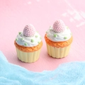 Detailed macro view of two resin cupcake figurines on pink textured surface - Large Raspberry Cupcake - Yellow Base