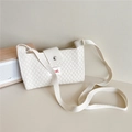 Close-up of cream knitted phone bag featuring diamond texture and silver magnetic snap - Cream
