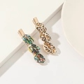 Detailed close-up of shell hair clips with leopard and colorful patterns on metal base - Leopard Print Shell 2-Piece Bobby Pin Set