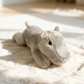 Adorable grey hippo plush doll in a lying position with soft fur on white rug - Grey Hippo