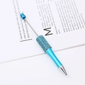 Light blue creative ballpoint pen with sparkling blue rhinestones and silver metal accents - Black Ink / Sapphire Blue