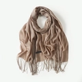 Elegant beige cashmere scarf with fringe details draped on a white background - Khaki