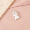 Detailed view of a white handcrafted glass fishbone pendant with blue eyes and metal ring - White Evil Eye Fish Single Loop (6#) / Steel