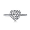 Macro shot of silver heart-shaped diamond ring with halo pavé setting and mirror reflection - White Heart Cut Style