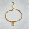Golden double layer herringbone chain bracelet featuring a letter R pendant charm - Gold-R