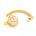 Close-up of golden pacifier clip with letter Q in pink rhinestone circle pendant - Letter Q