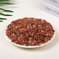 Polished reddish-brown natural crystal stones in a white plate for home decor - 100 Grams Of Southern Red Agate (5-7mm)