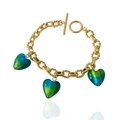 Detail of gold chain bracelet with blue heart glass pendants and toggle clasp - Bracelet / Green