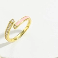 Detailed close-up of a 14K gold plated ring with pink enamel and sparkling zircon stones - Pink Enamel