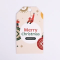 Close-up of beige Christmas tag with Santa Claus motif and Merry Christmas text - Waving Santa (White Card)