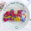 Colorful high-elastic hair bands in a transparent daisy zipper bag on a white plate - 50Pcs/Bag / Multicolor