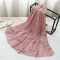Detail of soft pink chiffon shawl hanging on a black metal rack over marble - 175cmx70cm / Lotus Pink