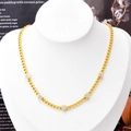Golden Cuban chain necklace featuring five pavé-set diamond heart pendants on a neck model - Necklace Gold