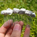 Handmade silver hair comb with natural white irregular crystals on grass background - White Turquoise Silver Comb Silver Wire
