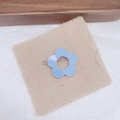Detailed view of light blue flower hair clip on rustic burlap and textured background - Light Blue