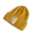 Ginger yellow knitted beanie for toddlers featuring a stylish white letter N patch - Yellow