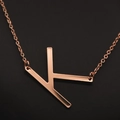 Elegant rose gold necklace with a polished capital letter K pendant on a fine chain - Rose Gold K