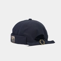Detail of adjustable metal buckle and vintage side patch on navy blue canvas docker hat - Adjustable / Standing Bear Dark Grey