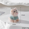 Detail of flocked resin dachshund pendant in green sweater with size and weight info - Westie in Green Clothes