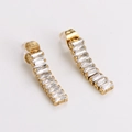 Detailed close-up of gold bar stud earrings featuring rectangular white zircon stones - White Zirconia