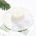 White lace sun hat with a wide brim and elegant mesh bow accent in a stylish flat lay - Leaf White