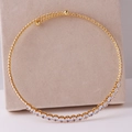 Elegant gold choker necklace featuring heart and water drop zircon stones on a beige display - Round Zirconia Style B / Gold