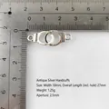 Detail of silver alloy handcuffs charm with Freedom engraving and measurement scale - Small / Antique Silver
