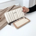 Cream long quilted faux leather wallet with vertical stitching and silver zip detail - Off White