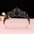Close-up of black and gold Baroque crown with intricate rhinestones and gems - Antique Gold Black Crystal Crown