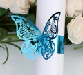Detailed close-up of blue butterfly napkin ring with metallic hollow-carved design - Reflective Blue