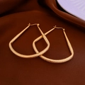 Detailed view of matte gold-plated geometric hoop earrings on dark silk background - 30# Golden Matte Irregular Trapezoid Earring