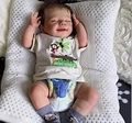 Sleeping 20-inch reborn baby doll in monkey print white T-shirt and gray socks - Monkey Print Style / Normal Painted Cloth Body
