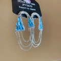 Macro di orecchini in argento 925 con zirconi blu e frange su carta da esposizione - Blu