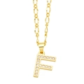Detailed view of golden letter F pendant with micro-paved zircons on a Figaro chain - Letter F