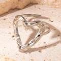 Adjustable silver heart ring with irregular hammered texture on a minimalist band - Heart Steel Color 57