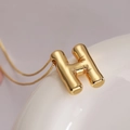 Chic 3D balloon letter H pendant necklace in gold finish with a refined box chain - Letter H