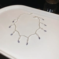 Bracelet argenté avec cristaux gouttes violets et fermoir mousqueton réglable - Style Pendentif Goutte d'Eau Violet Argent