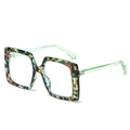 Classic square oversized sunglasses featuring multi-color marbled frames and translucent green arms - Green Floral Frame