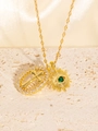 Golden sun evil eye pendant necklace with green gemstone and cross charm on stone background - Gold Necklace with Oval Cross and Sun God Eye Pendant (26-4)