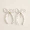 Elegant white pearl bow earrings with polished beads and silver needle backing - Bow Pearl Stud (1026) / Silver